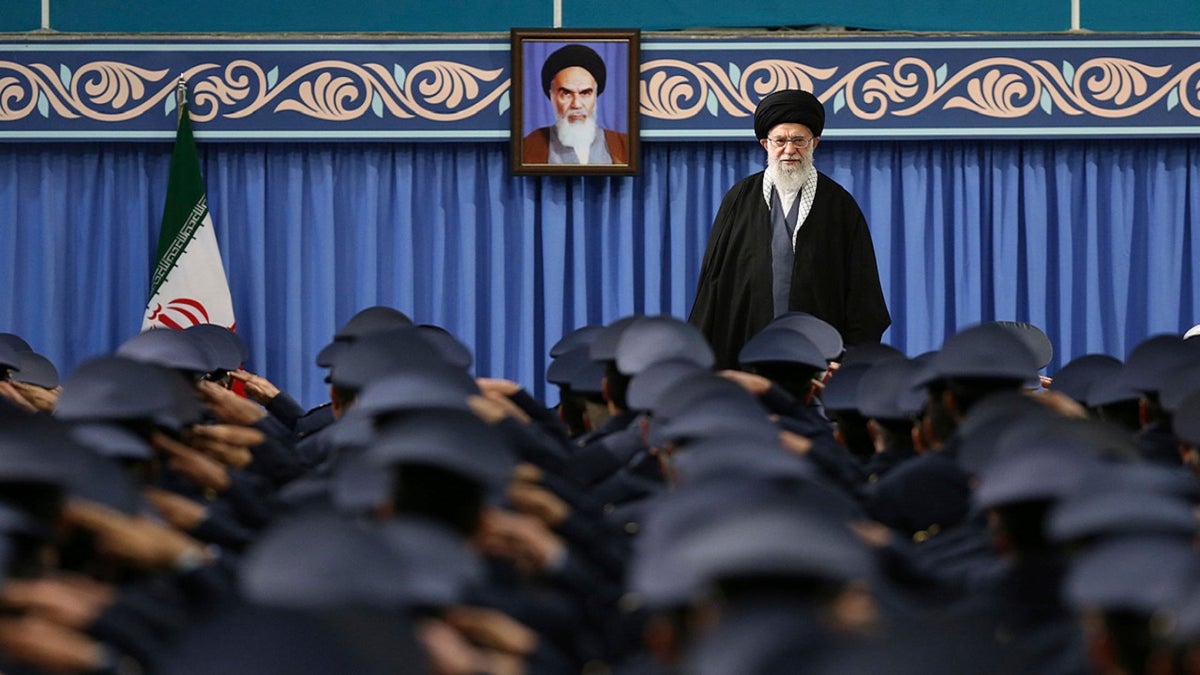 Supreme Leader Ayatollah Ali Khamenei stands as the army, air force and air defense salute at the start of their meeting in Tehran, Iran, on Feb. 8, 2018.(Office of the Iranian Supreme Leader's Official Website via AP)