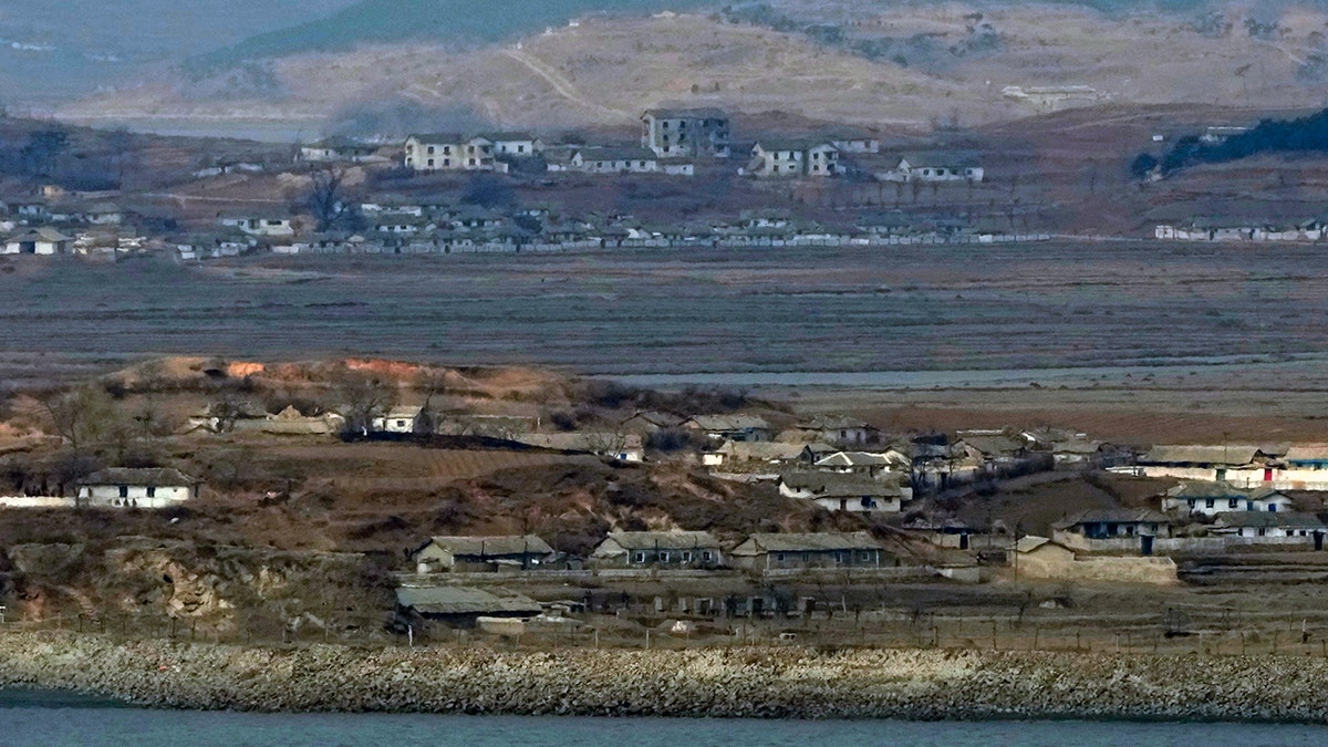 Neighborhoods of North Korea's Kaepoong village are seen from the observation post in Ganghwa, near the border with South Korea.(AP Photo/Ahn Young-joon)