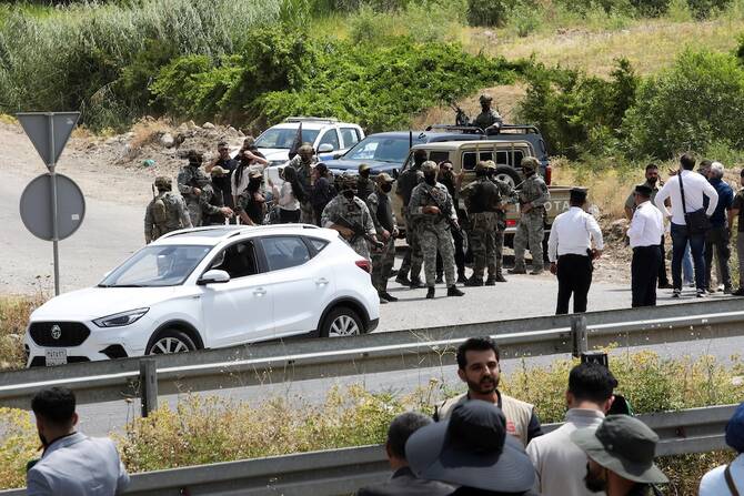 Kurdish PKK militants begin handing over weapons in cave in Iraq
